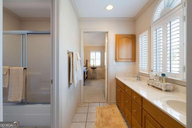 bathroom featuring tile patterned flooring, vanity, a wealth of natural light, and ornamental molding