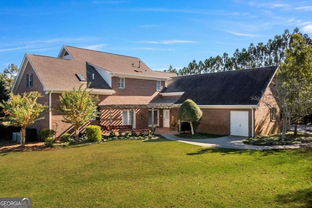 rear view of property featuring a lawn