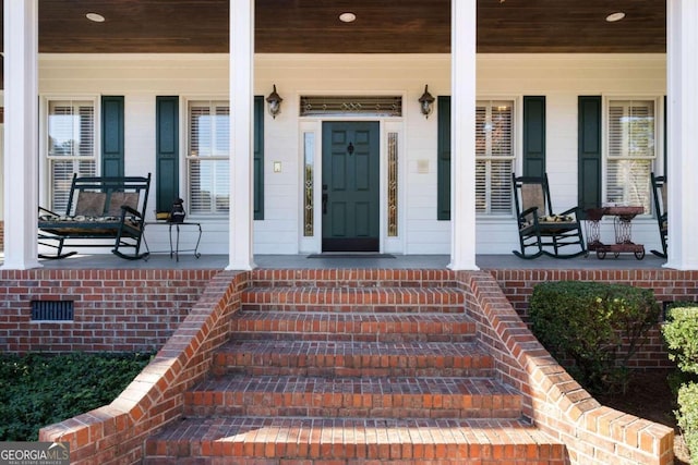 doorway to property with a porch