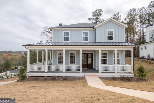 view of front of property featuring covered porch and french doors