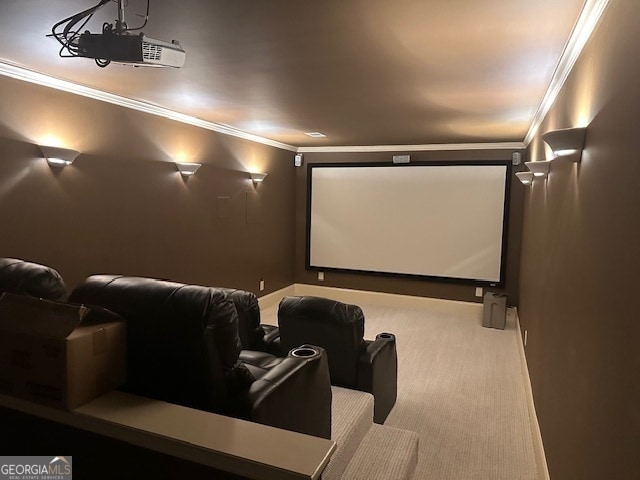 carpeted home theater room featuring crown molding