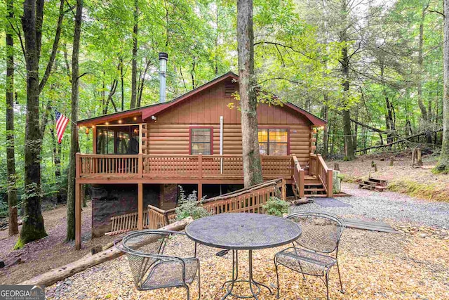 rear view of house with a deck