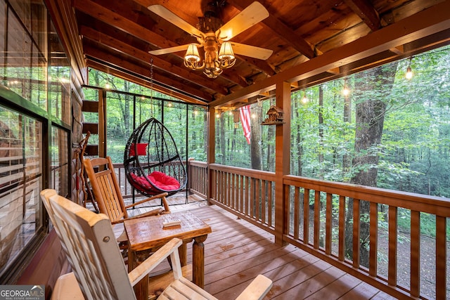 wooden deck featuring ceiling fan