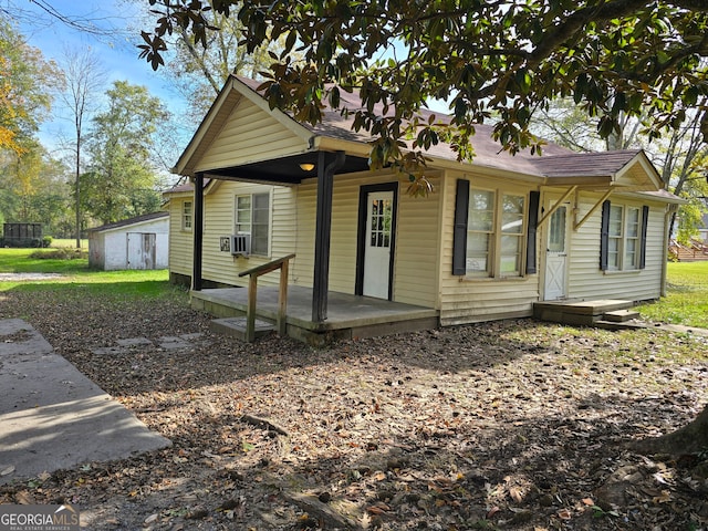 rear view of property with cooling unit