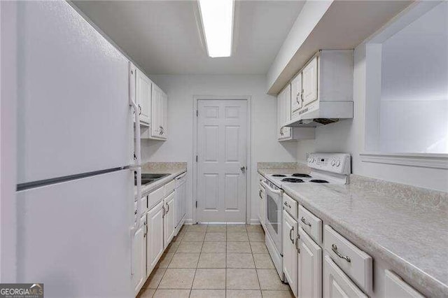 kitchen featuring white cabinets, white appliances, and light tile patterned floors