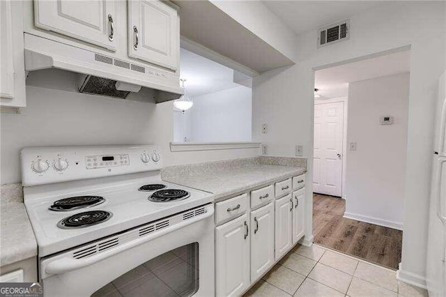 kitchen with white range with electric cooktop, white cabinets, and light wood-type flooring