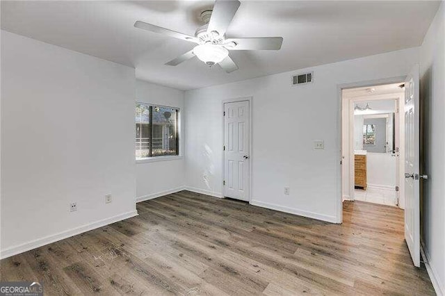 unfurnished bedroom featuring ceiling fan and hardwood / wood-style floors