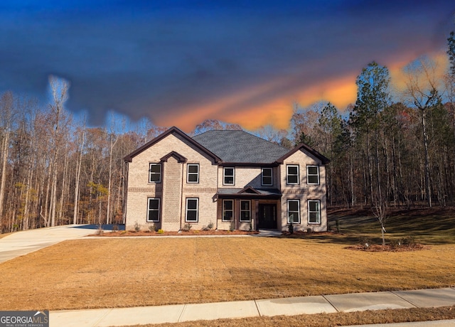 view of front of property with a lawn