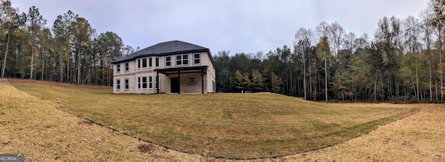 exterior space featuring a front yard