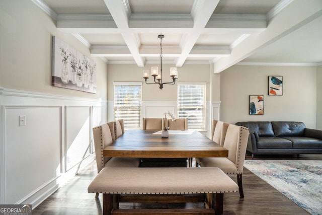 dining area featuring coffered ceiling, an inviting chandelier, beamed ceiling, hardwood / wood-style floors, and ornamental molding