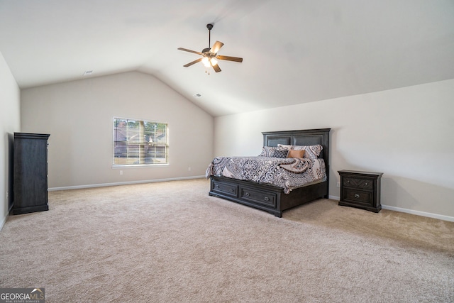 bedroom featuring ceiling fan, lofted ceiling, and light carpet