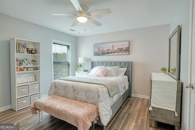 bedroom featuring ceiling fan and hardwood / wood-style floors