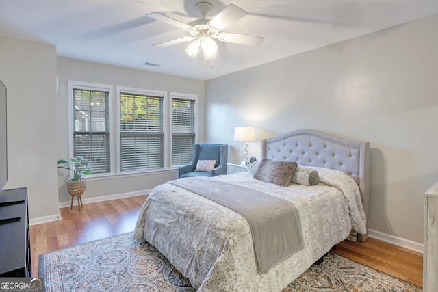 bedroom featuring ceiling fan and hardwood / wood-style flooring