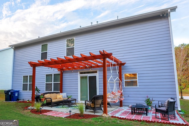 rear view of house with a pergola, a lawn, an outdoor living space with a fire pit, and a patio