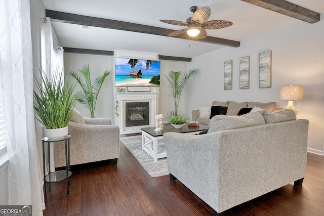 living room featuring ceiling fan, dark hardwood / wood-style flooring, and beamed ceiling