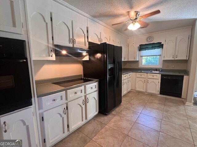 kitchen featuring black appliances, white cabinetry, light tile patterned flooring, and ornamental molding