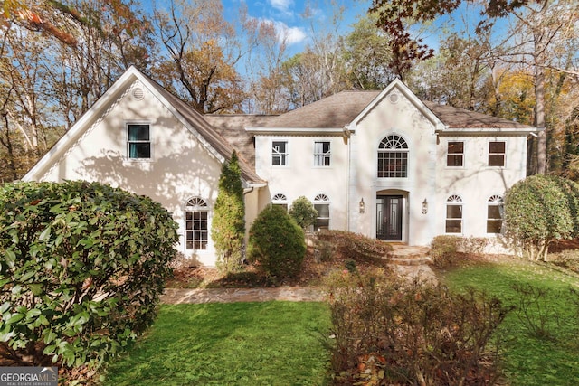 view of front of property with french doors and a front yard