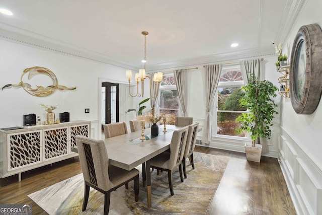 unfurnished room with plenty of natural light, dark hardwood / wood-style floors, and ornamental molding