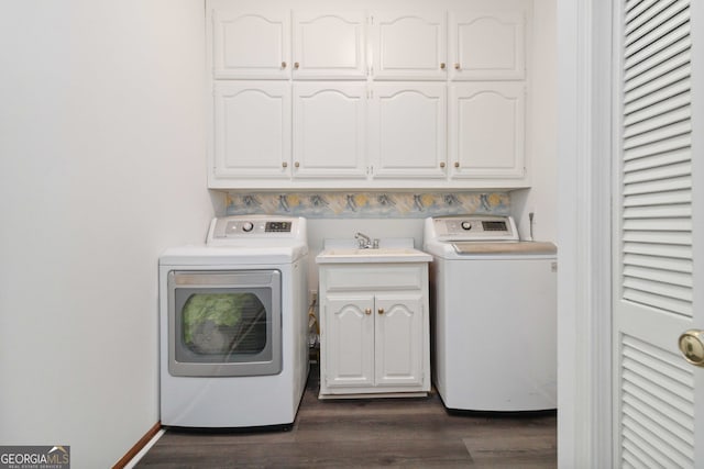 washroom with separate washer and dryer, sink, cabinets, and dark hardwood / wood-style floors