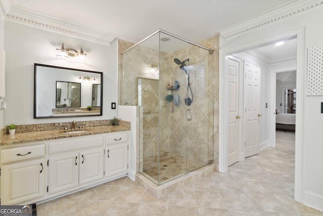 bathroom with tile patterned floors, vanity, ornamental molding, and walk in shower