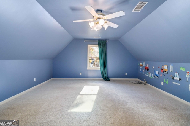 bonus room featuring lofted ceiling, ceiling fan, and light colored carpet