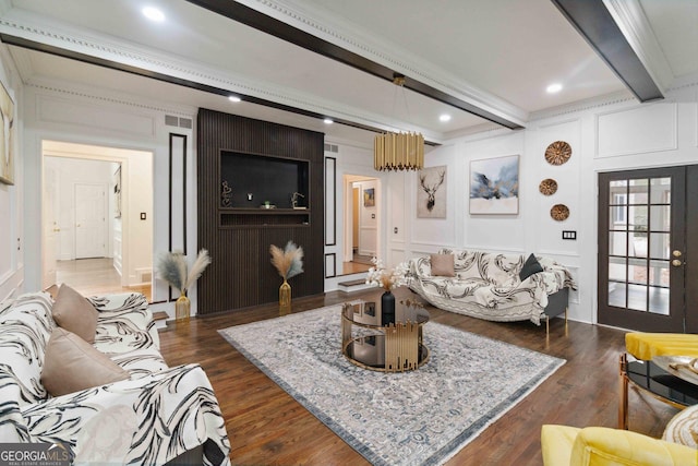 living room featuring french doors, dark hardwood / wood-style flooring, ornamental molding, and beam ceiling