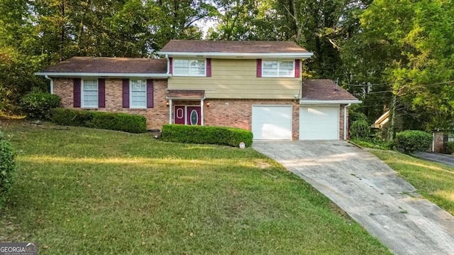 split level home featuring a garage and a front lawn