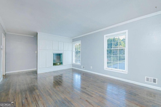 unfurnished living room with dark hardwood / wood-style floors and ornamental molding