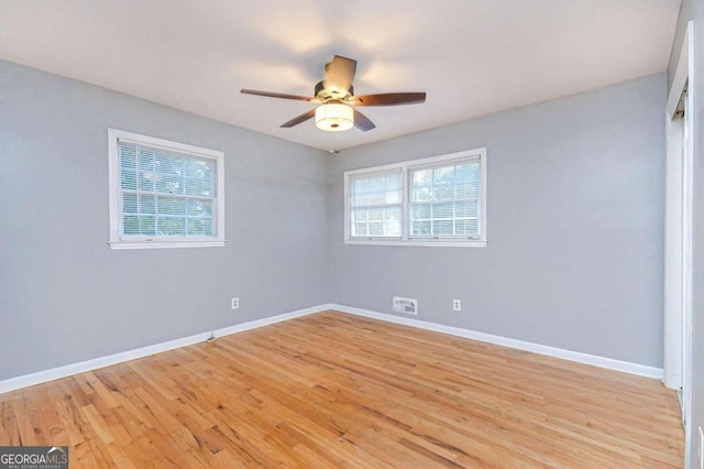 spare room with light hardwood / wood-style flooring and ceiling fan