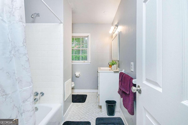 full bathroom featuring tile patterned flooring, vanity, shower / bath combo, and toilet