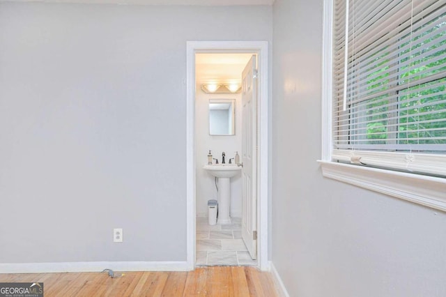 interior space with hardwood / wood-style flooring and sink