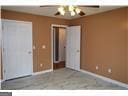 177 Frix Ln SE, Calhoun, GA 30701 - unfurnished bedroom with ceiling fan
