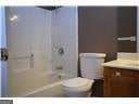 177 Frix Ln SE, Calhoun, GA 30701 - full bathroom with vanity, toilet, and  shower combination