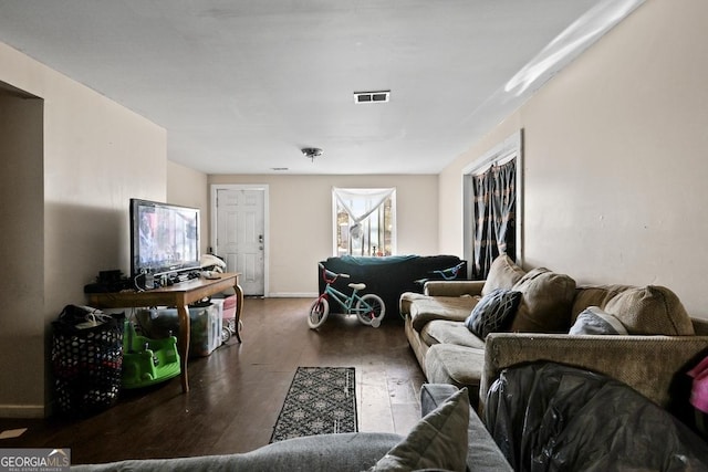 living room featuring dark wood-type flooring