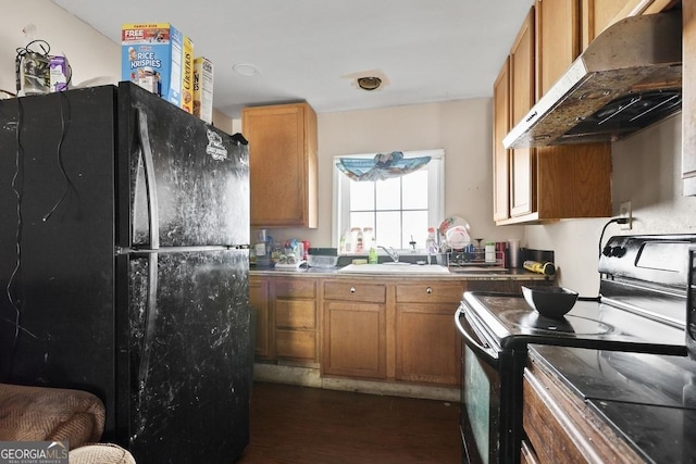 kitchen with dark wood-type flooring, black appliances, and sink