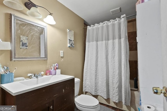 bathroom with vanity and toilet