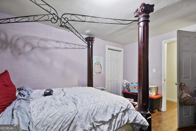 bedroom with hardwood / wood-style floors