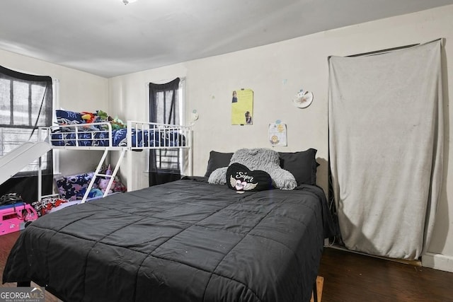 bedroom featuring dark wood-type flooring