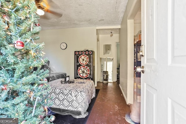 bedroom with a textured ceiling and ceiling fan