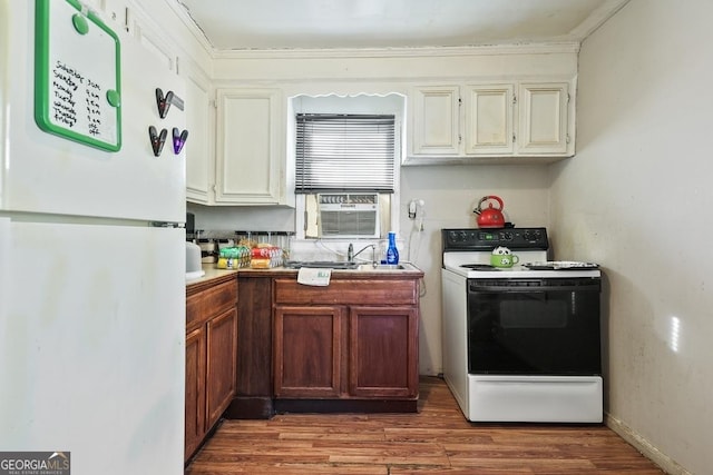 kitchen with white fridge, hardwood / wood-style floors, sink, electric range oven, and cooling unit