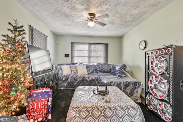 living room featuring a textured ceiling, ceiling fan, and carpet floors