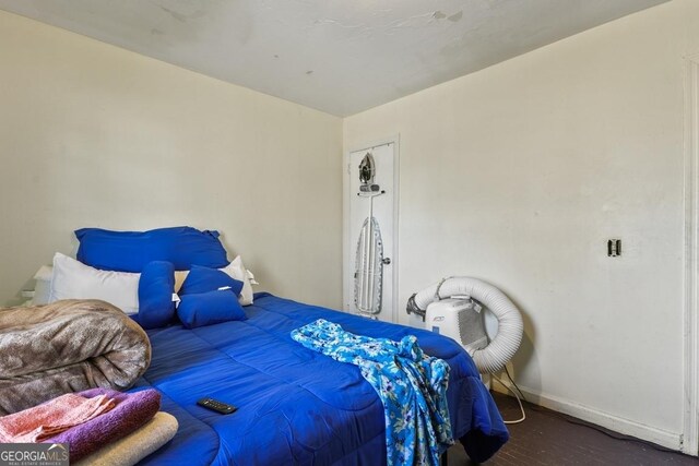 bedroom featuring dark wood-type flooring