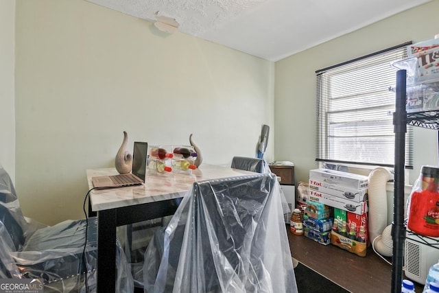 dining room featuring a textured ceiling