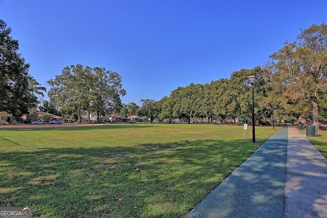 view of home's community featuring a lawn