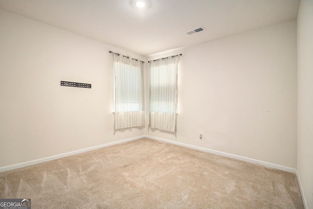 unfurnished room with carpet flooring