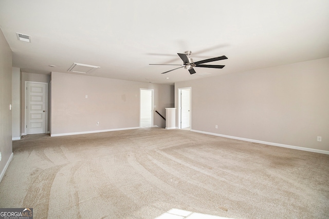 carpeted empty room featuring ceiling fan