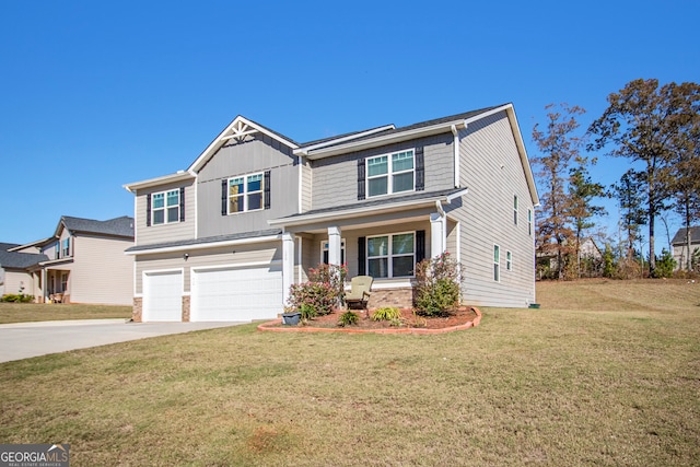 craftsman-style house featuring a front yard and a garage