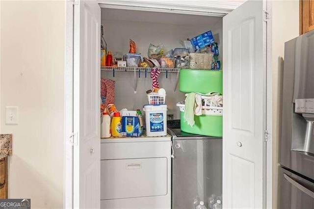 washroom featuring washer and dryer