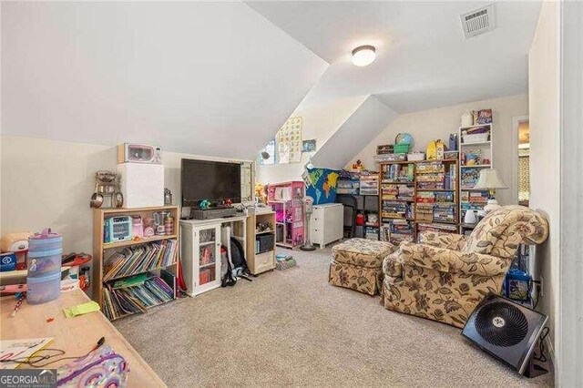 game room featuring light carpet and vaulted ceiling