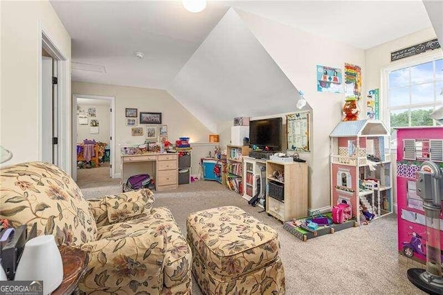 recreation room featuring carpet and vaulted ceiling